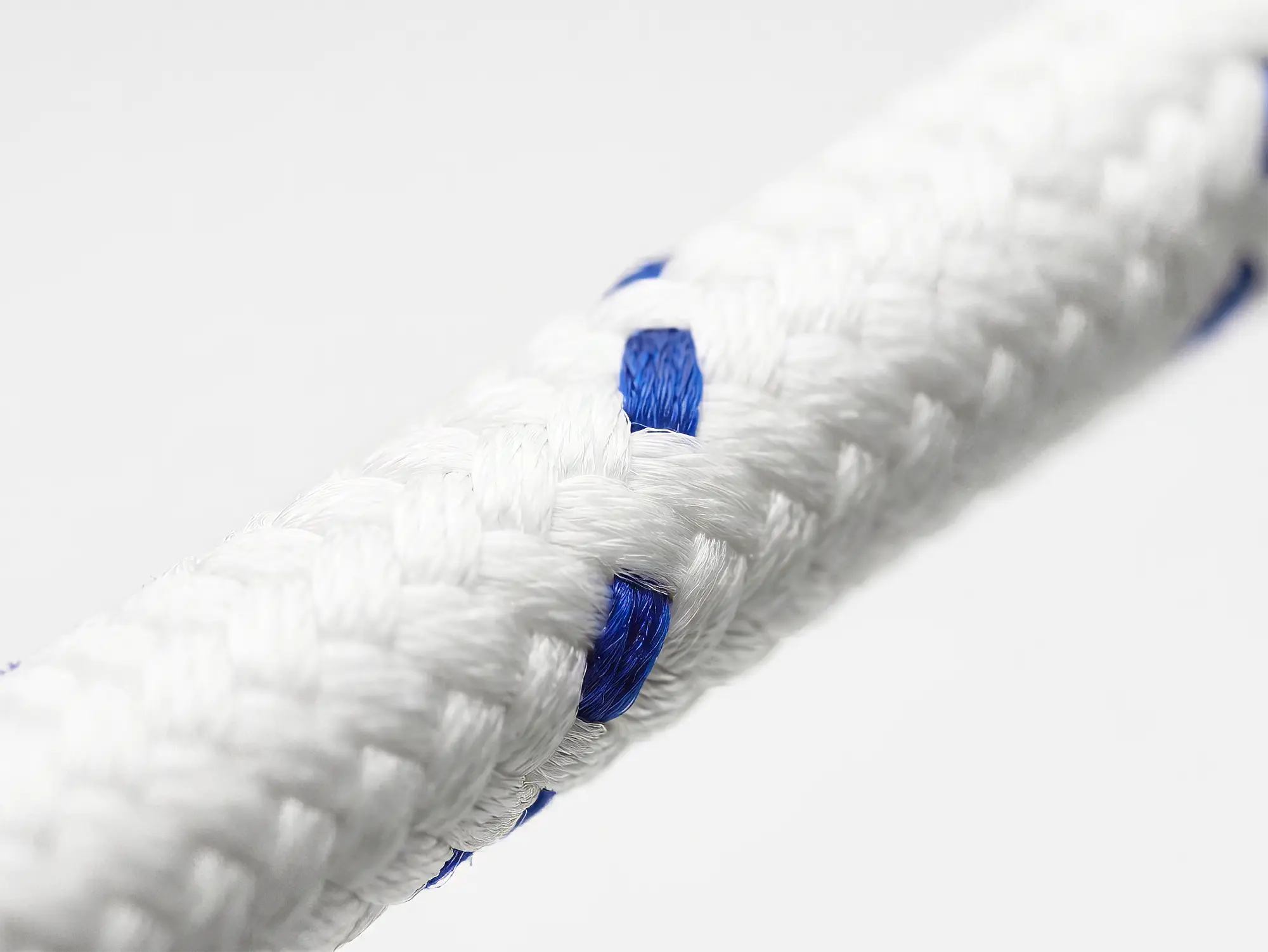 Macro photograph of 24 Plait Matt spun polyester rope showing matte textured surface and blue tracer detail