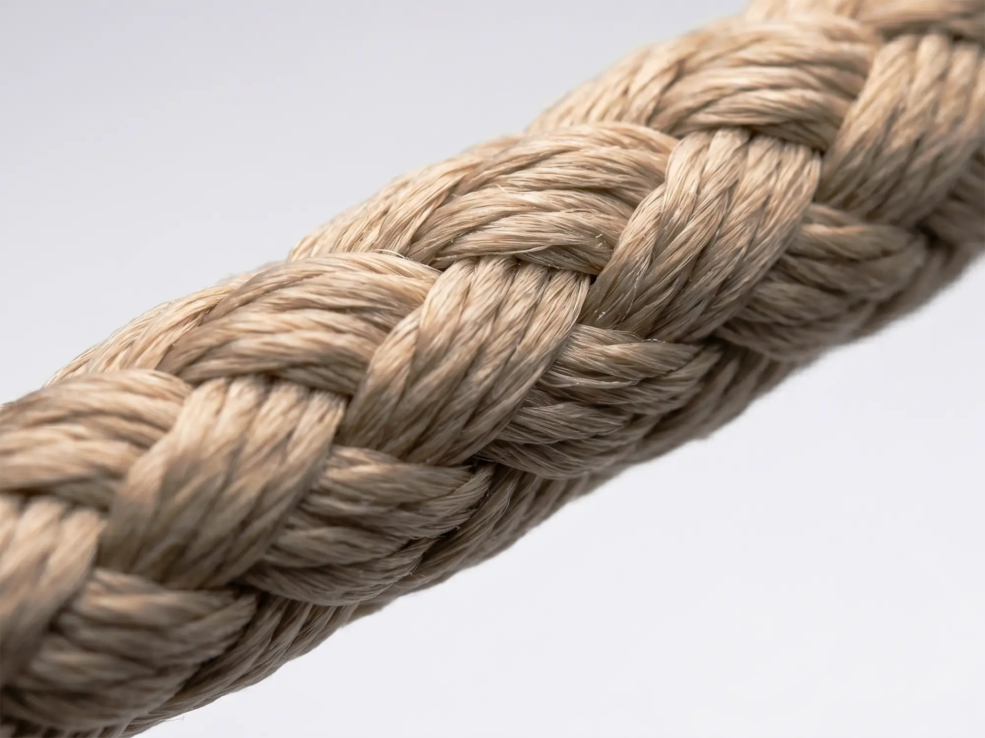 Macro photograph of English Braids 8-Plait Matt buff spun polyester rope showing matte textured surface and 8-plait construction