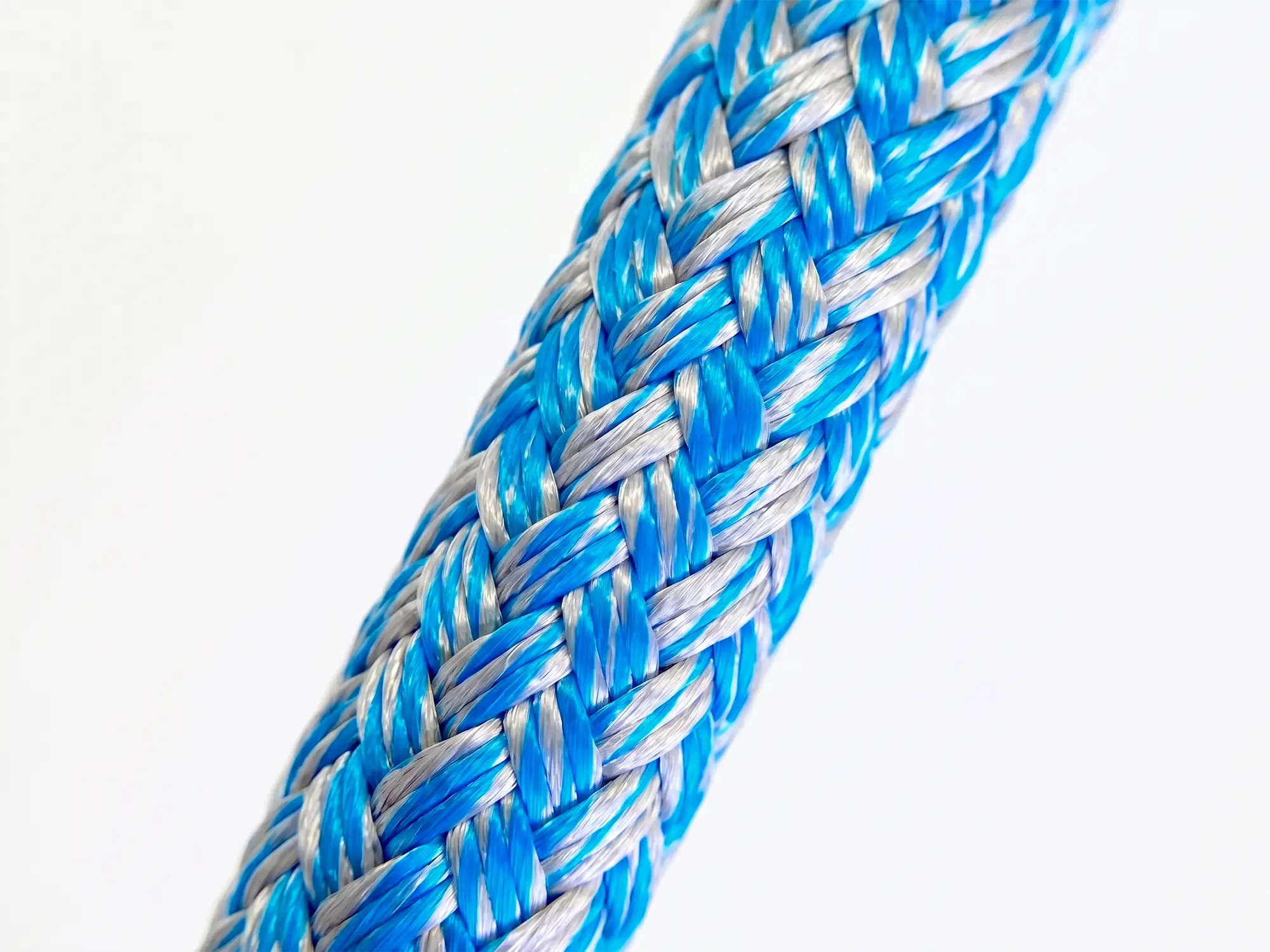 Macro photograph of Silverline blue polyester double braid showing 24-plait cover construction and individual fibre detail