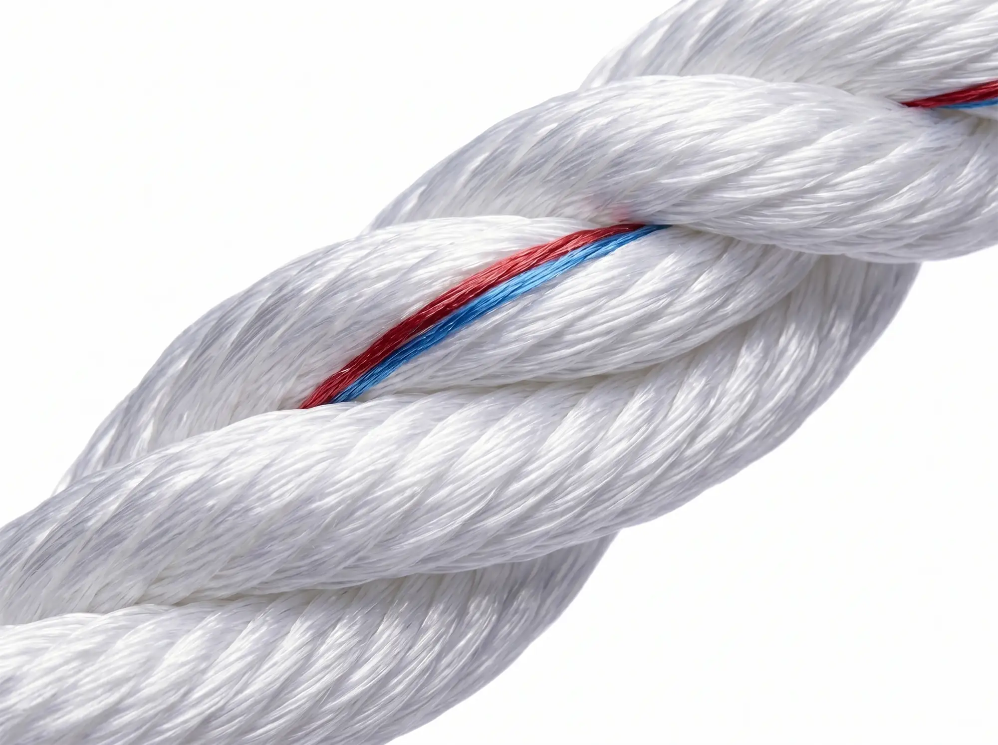Macro photograph of white 3-strand nylon rope with red and blue tracer strands showing hawser-laid filament construction