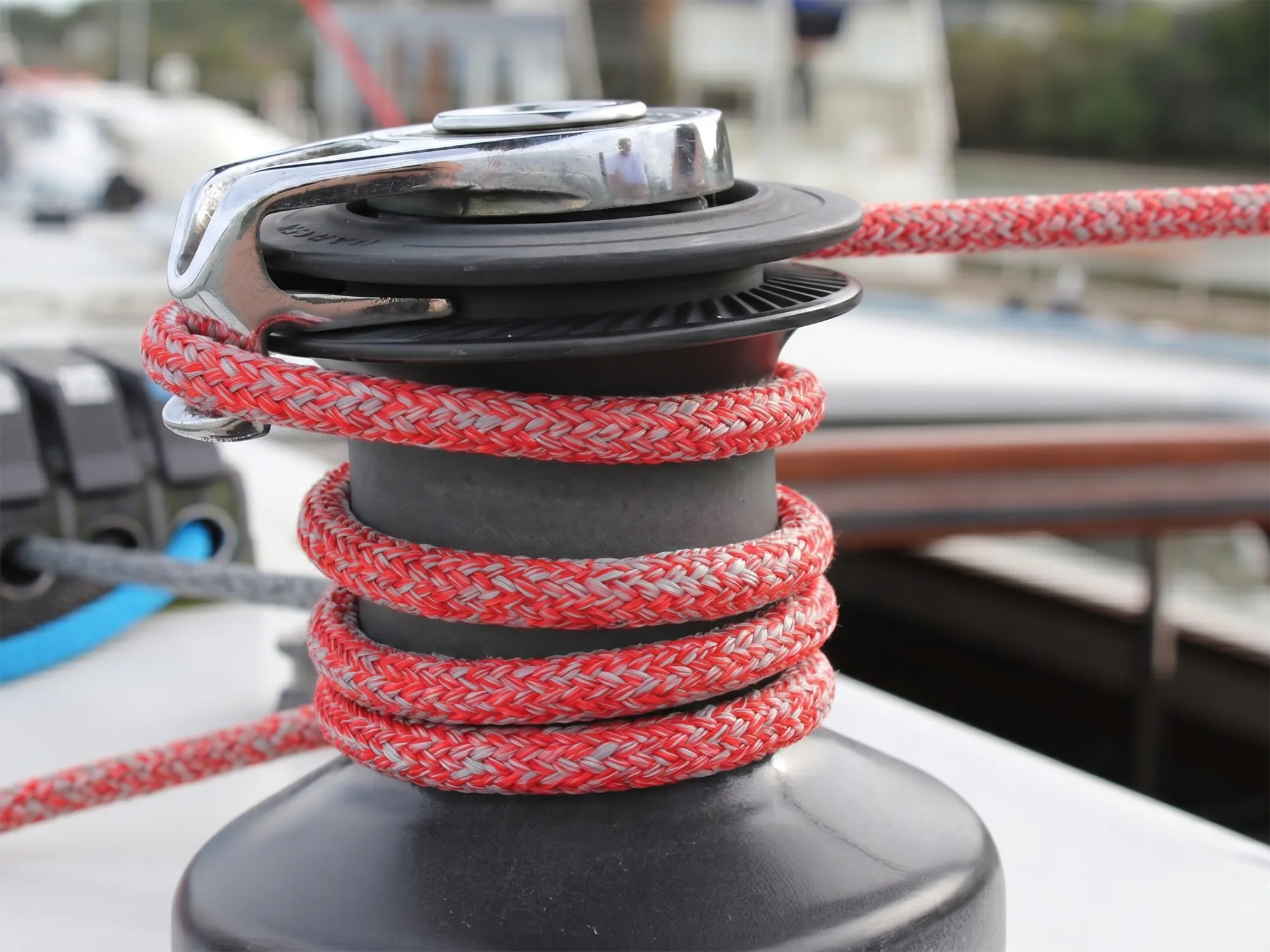 Red and silver SK75 Racing Dyneema® rope on a self-tailing yacht winch with rope clutches in background